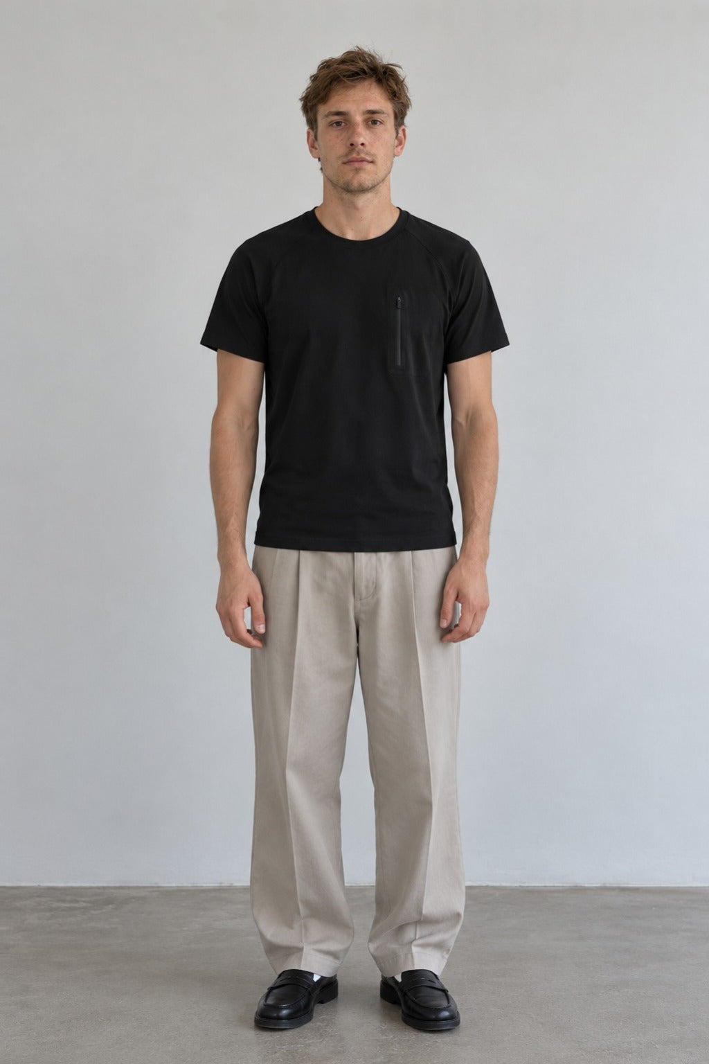 Range Tee in Black, front view on model