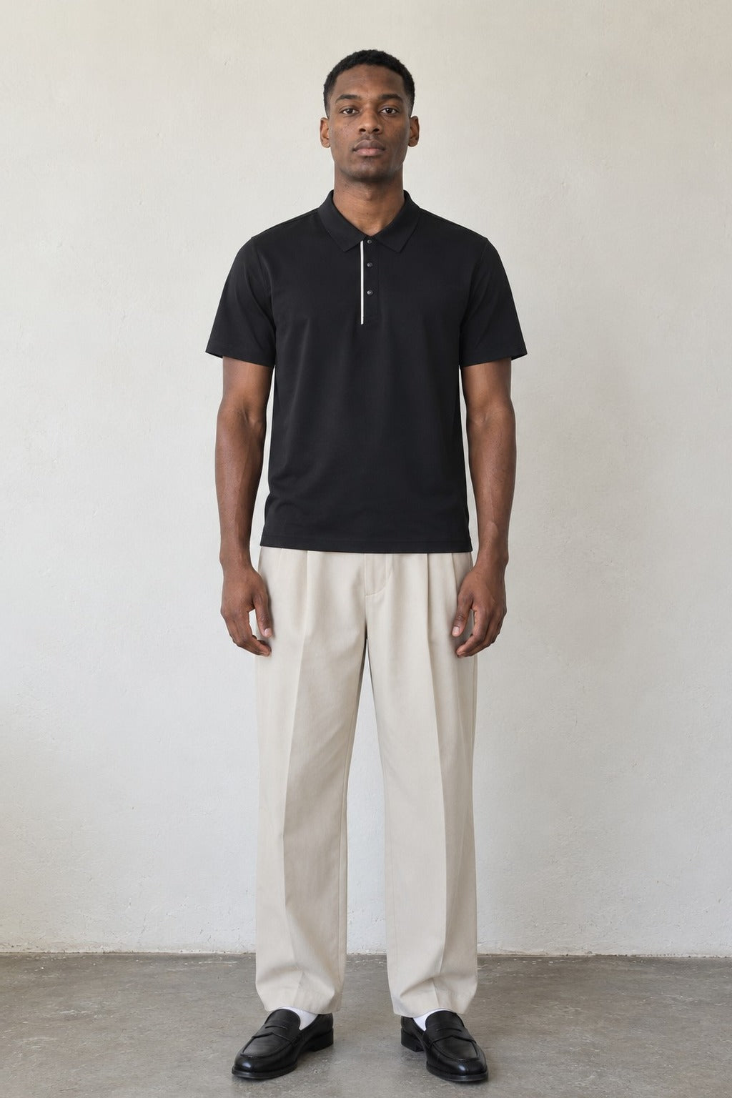 Fairway Polo in Black, front view on model